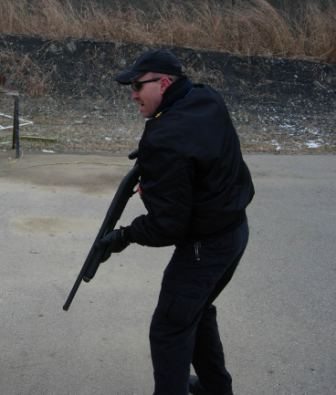 Officer using a shotgun