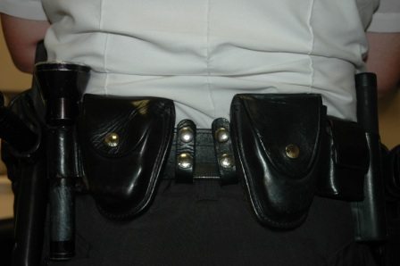 Two belt keepers positioned between handcuff cases